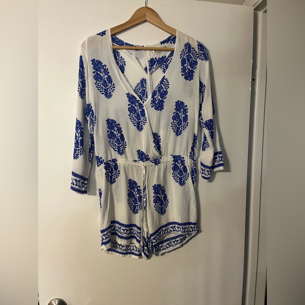 Long sleeve, light weight blue & white romper. Size small.